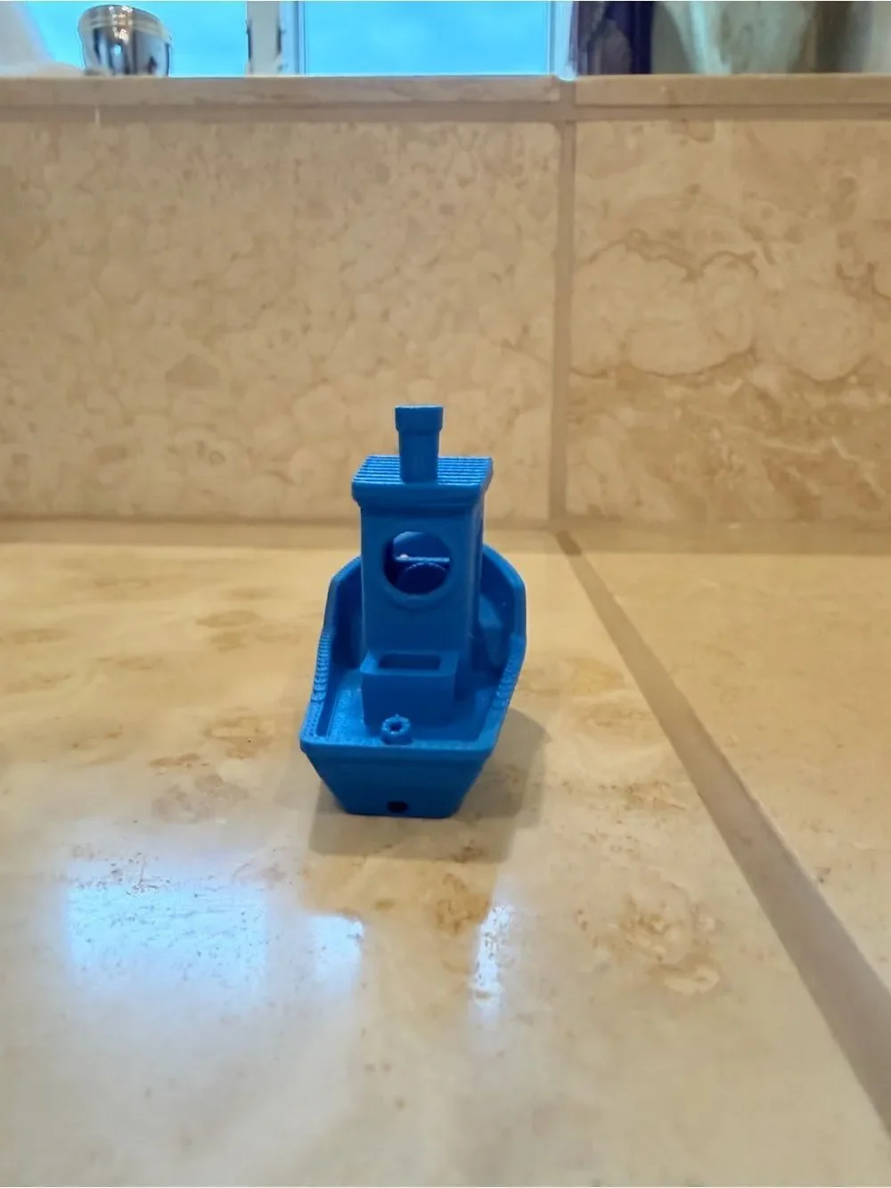 Small 3D-Printed Toy Boat in Bright Blue